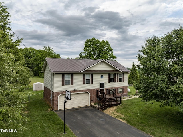 115 Maple Ridge Dr, Jonesborough, TN 37659 - raised ranch with brick siding, driveway, a garage, a front lawn, and metal roof
