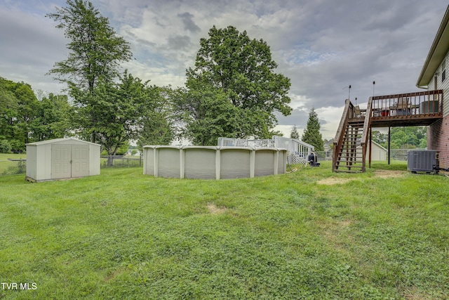 115 Maple Ridge Dr, Jonesborough, TN 37659 - view of yard with central air condition unit, stairway, a deck, a storage shed, and an outdoor pool
