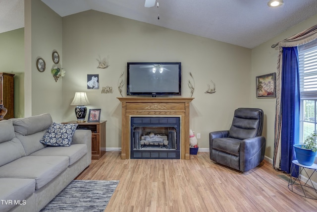 115 Maple Ridge Dr, Jonesborough, TN 37659 - living area featuring vaulted ceiling, wood finished floors, a fireplace, a ceiling fan, and baseboards