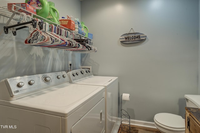 115 Maple Ridge Dr, Jonesborough, TN 37659 - washroom with washer and clothes dryer, baseboards, and wood finished floors