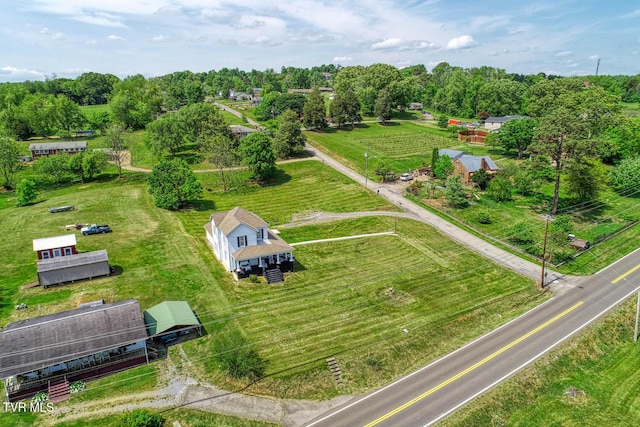birds eye view of property with a rural view