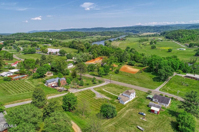 drone / aerial view with a water view and a rural view
