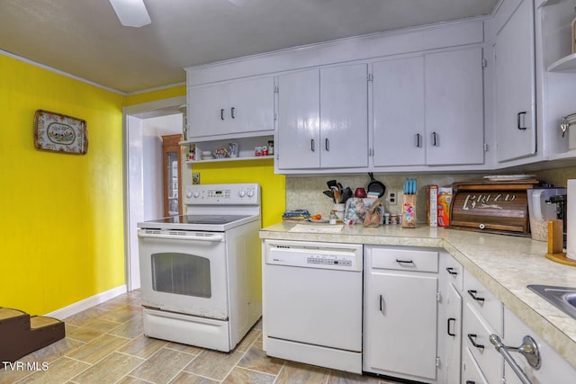 kitchen with baseboards, open shelves, white appliances, and light countertops