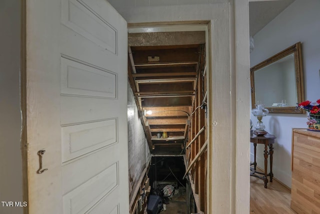 stairway with wood finished floors