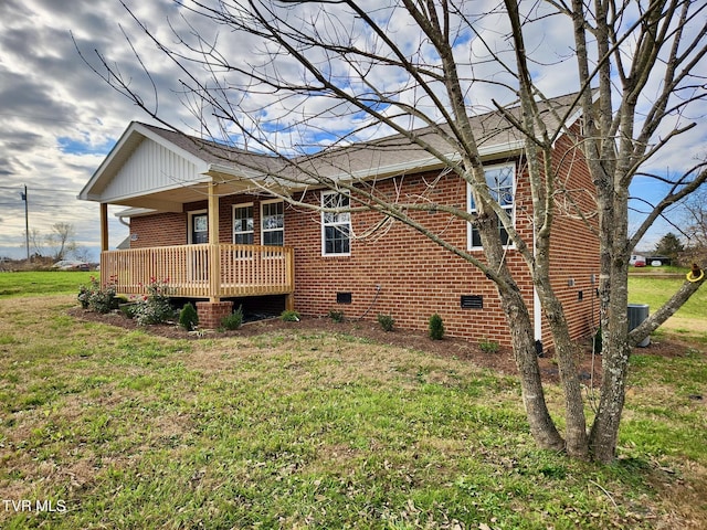 115 Rb Miller Rd, Limestone, TN 37681 - rear view of property featuring covered porch, brick siding, central AC unit, crawl space, and a yard