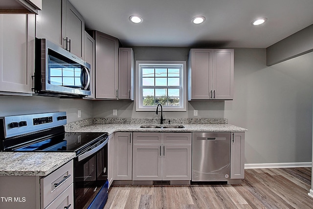 115 Rb Miller Rd, Limestone, TN 37681 - kitchen with appliances with stainless steel finishes, a sink, baseboards, recessed lighting, and light wood-style flooring