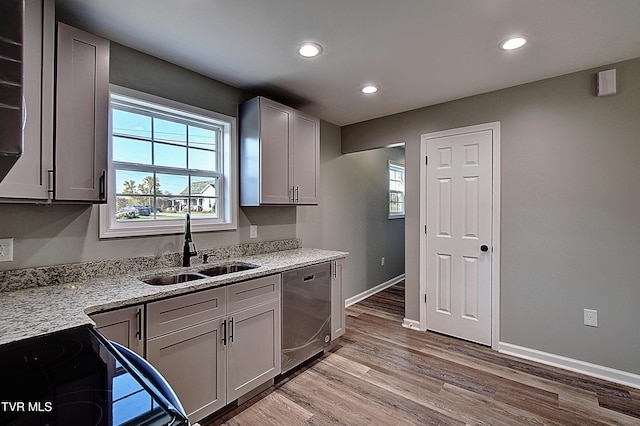 115 Rb Miller Rd, Limestone, TN 37681 - kitchen with stainless steel dishwasher, a sink, light wood-style floors, and a wealth of natural light