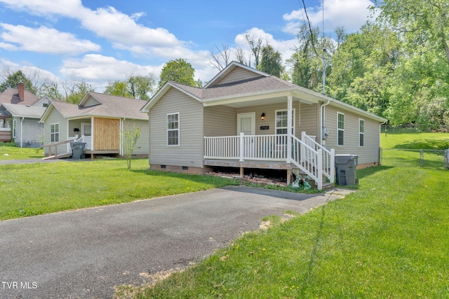 228 Taylor St, Bristol, TN 37620 - view of front of property with fence, a porch, a front lawn, and crawl space