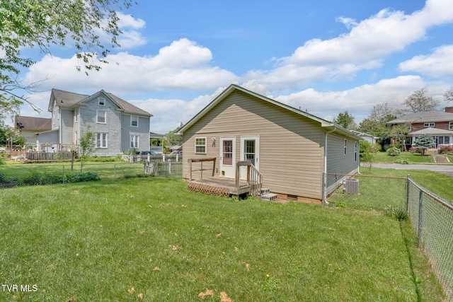 228 Taylor St, Bristol, TN 37620 - rear view of property featuring a yard, crawl space, a wooden deck, and a fenced backyard