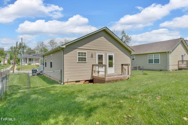 228 Taylor St, Bristol, TN 37620 - rear view of property with crawl space, a deck, a gate, a fenced backyard, and a yard