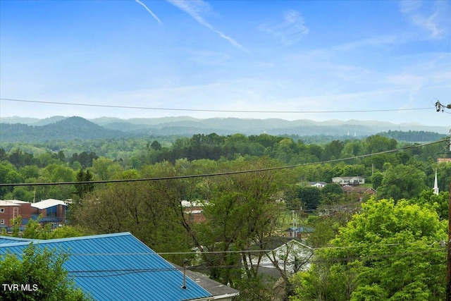 exterior space featuring a forest view