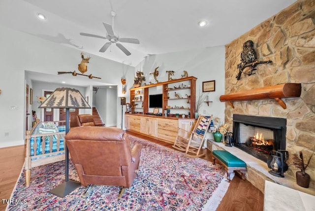 342 Ripshin Lake Rd, Roan Mountain, TN 37687 - living area with a stone fireplace, a ceiling fan, recessed lighting, wood finished floors, and lofted ceiling
