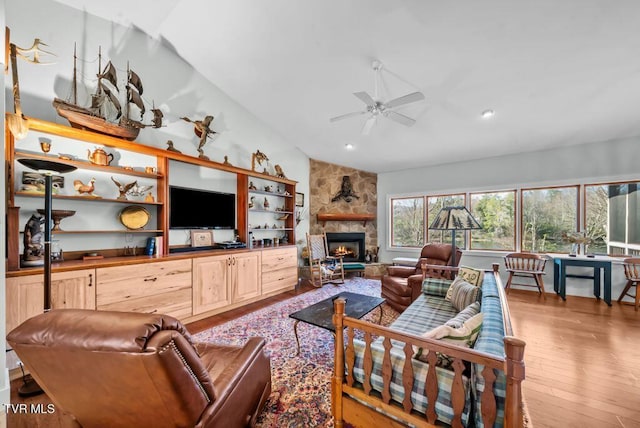 342 Ripshin Lake Rd, Roan Mountain, TN 37687 - living area featuring a stone fireplace, a ceiling fan, recessed lighting, wood finished floors, and vaulted ceiling