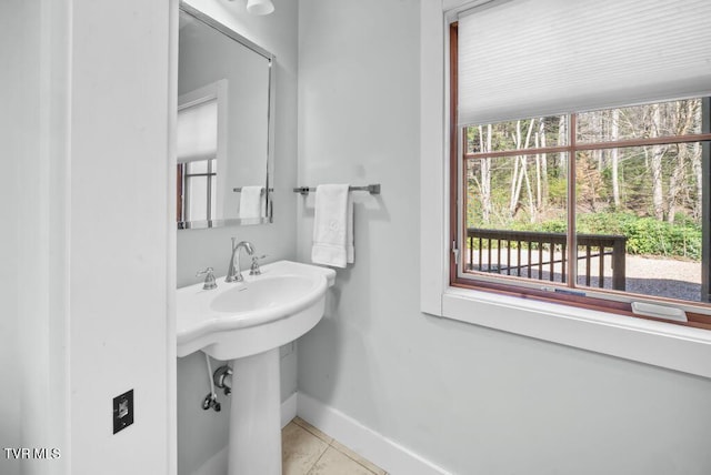 342 Ripshin Lake Rd, Roan Mountain, TN 37687 - bathroom featuring baseboards and tile patterned floors