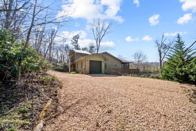 342 Ripshin Lake Rd, Roan Mountain, TN 37687 - view of home's exterior featuring a garage, driveway, and a deck