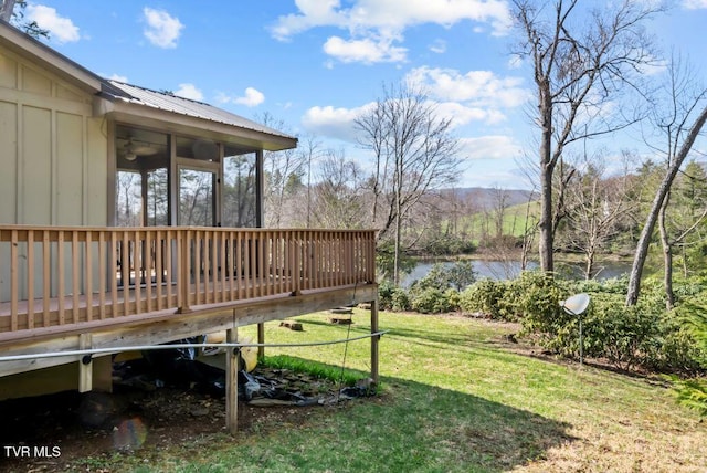 342 Ripshin Lake Rd, Roan Mountain, TN 37687 - view of yard featuring a sunroom and a deck with water view