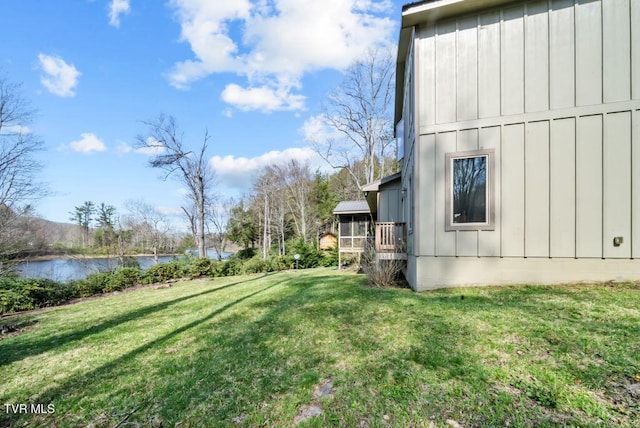 342 Ripshin Lake Rd, Roan Mountain, TN 37687 - exterior space with a lawn, a water view, and board and batten siding
