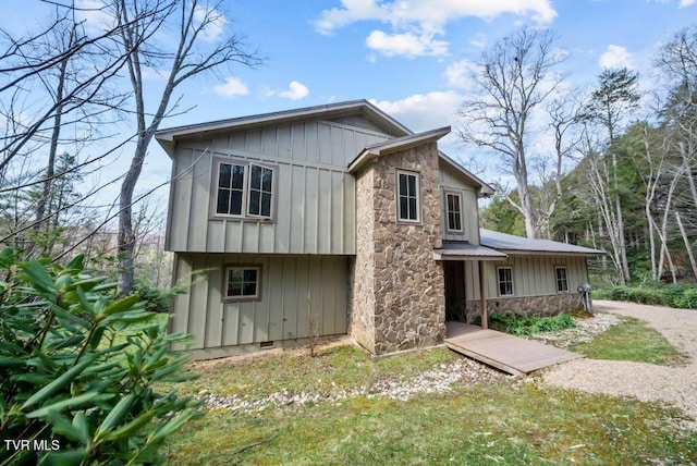 342 Ripshin Lake Rd, Roan Mountain, TN 37687 - view of front of home with crawl space, board and batten siding, and stone siding