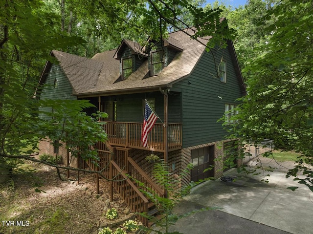 1008 Cox Trail Pl, Kingsport, TN 37660 - view of front of house featuring a porch, stairway, and a shingled roof