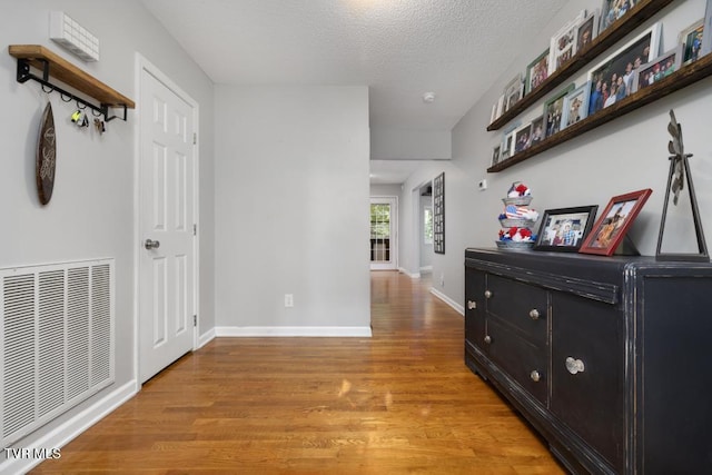 1008 Cox Trail Pl, Kingsport, TN 37660 - hall with light wood-style flooring and a textured ceiling