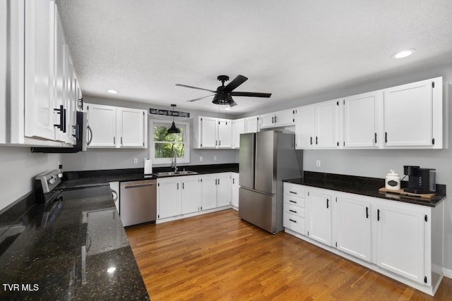 1008 Cox Trail Pl, Kingsport, TN 37660 - kitchen featuring stainless steel appliances, recessed lighting, a ceiling fan, dark stone countertops, and white cabinetry