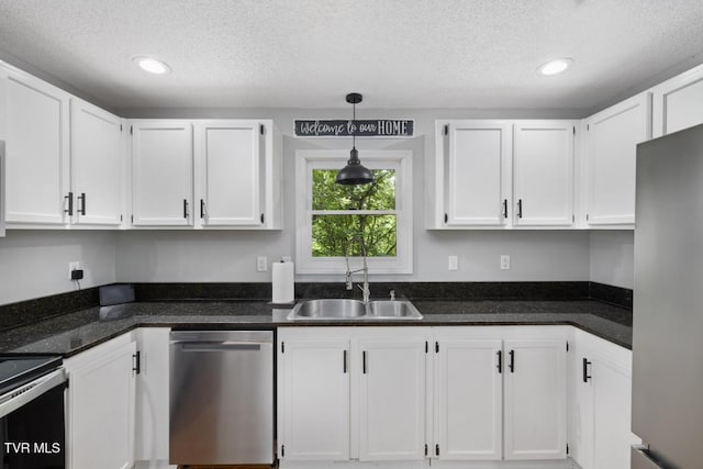 1008 Cox Trail Pl, Kingsport, TN 37660 - kitchen featuring appliances with stainless steel finishes, a textured ceiling, white cabinets, hanging light fixtures, and recessed lighting