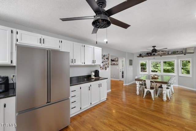 1008 Cox Trail Pl, Kingsport, TN 37660 - kitchen featuring high quality fridge, a ceiling fan, dark countertops, white cabinetry, and light wood-style floors