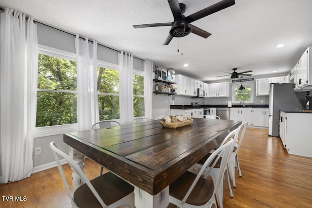 1008 Cox Trail Pl, Kingsport, TN 37660 - dining area with a ceiling fan, light wood-type flooring, recessed lighting, and a textured ceiling