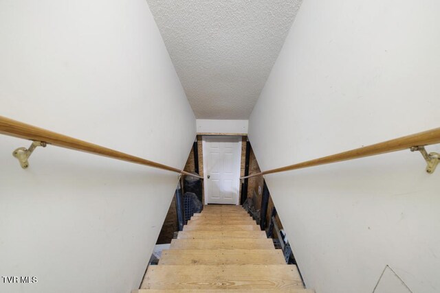1008 Cox Trail Pl, Kingsport, TN 37660 - stairs featuring a textured ceiling