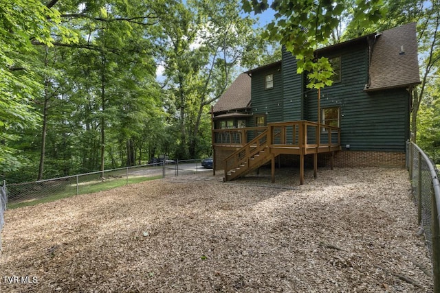 1008 Cox Trail Pl, Kingsport, TN 37660 - back of property with stairway, a deck, a fenced backyard, a shingled roof, and a chimney