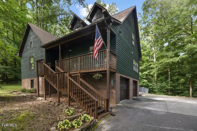 1008 Cox Trail Pl, Kingsport, TN 37660 - view of front of house featuring asphalt driveway, an attached garage, stairway, and a shingled roof