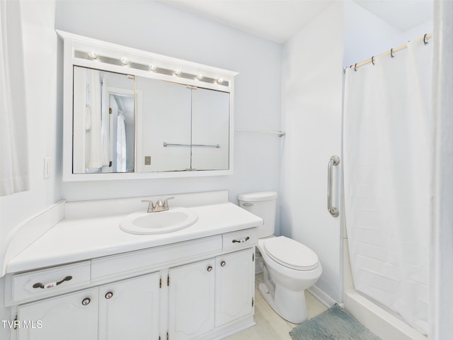 bathroom with toilet, a shower with shower curtain, and vanity