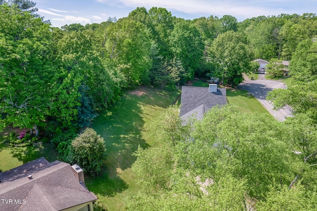 bird's eye view featuring a forest view