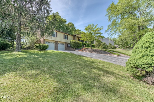 view of front of property featuring a garage, a front yard, brick siding, and aphalt driveway