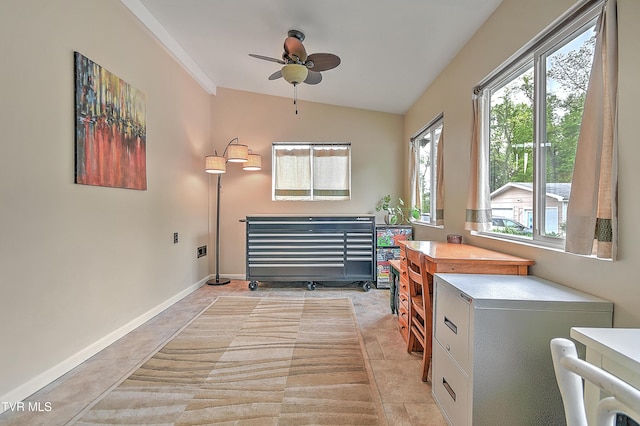 interior space featuring baseboards and a ceiling fan