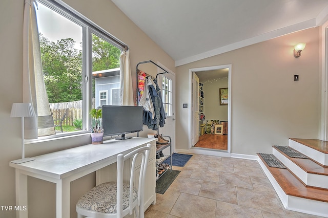 home office with baseboards, a wealth of natural light, and lofted ceiling