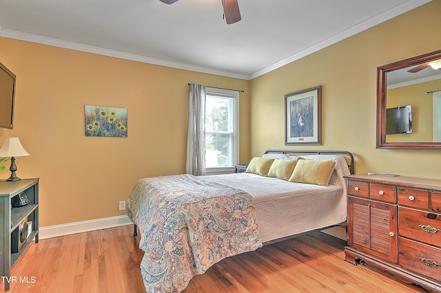 bedroom with baseboards, ornamental molding, ceiling fan, and light wood finished floors