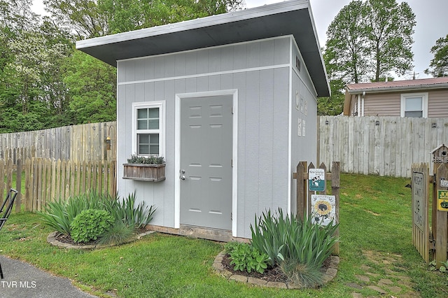 view of shed featuring a fenced backyard