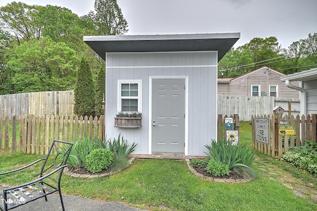 view of shed with fence