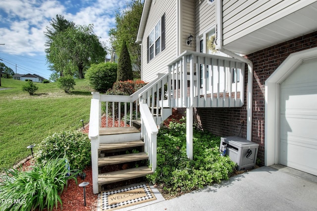 exterior space featuring a lawn and ac unit