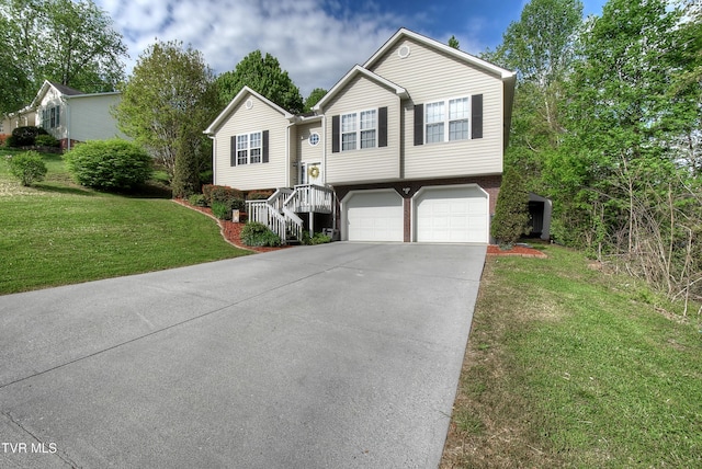 bi-level home with an attached garage, a front lawn, brick siding, and concrete driveway