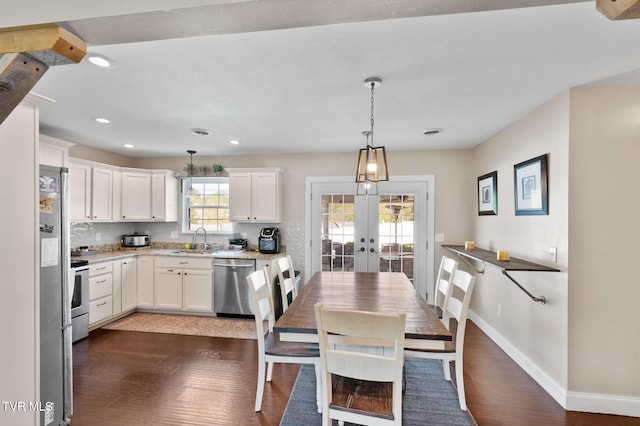 105 Dewey Ct, Bristol, VA 24201 - kitchen with french doors, dark wood-style flooring, appliances with stainless steel finishes, a sink, and white cabinetry