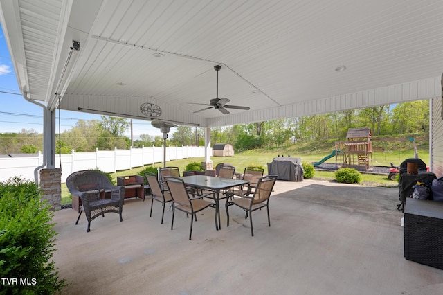 105 Dewey Ct, Bristol, VA 24201 - view of patio / terrace featuring fence, a shed, a playground, an outbuilding, and outdoor dining space
