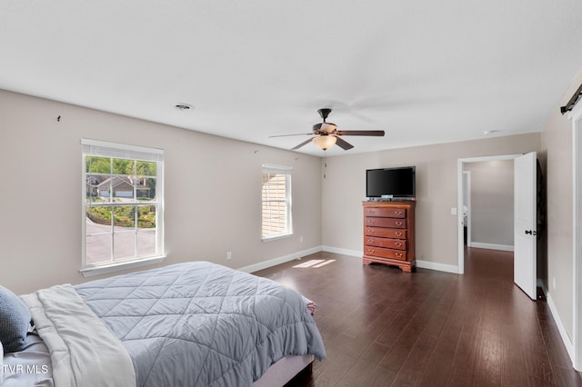 105 Dewey Ct, Bristol, VA 24201 - bedroom with baseboards, visible vents, a ceiling fan, and dark wood-type flooring