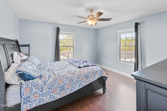 105 Dewey Ct, Bristol, VA 24201 - bedroom with a ceiling fan, baseboards, multiple windows, and dark wood-type flooring