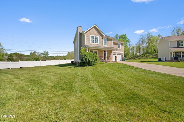 105 Dewey Ct, Bristol, VA 24201 - traditional-style home with a front lawn, fence, a chimney, an attached garage, and driveway