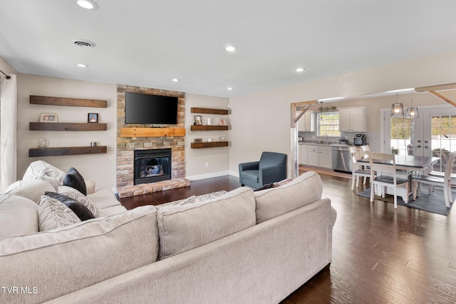 105 Dewey Ct, Bristol, VA 24201 - living area with visible vents, a fireplace, baseboards, recessed lighting, and dark wood-type flooring