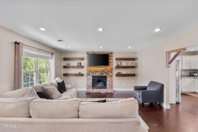 105 Dewey Ct, Bristol, VA 24201 - living room featuring dark wood-style flooring, baseboards, recessed lighting, and a stone fireplace