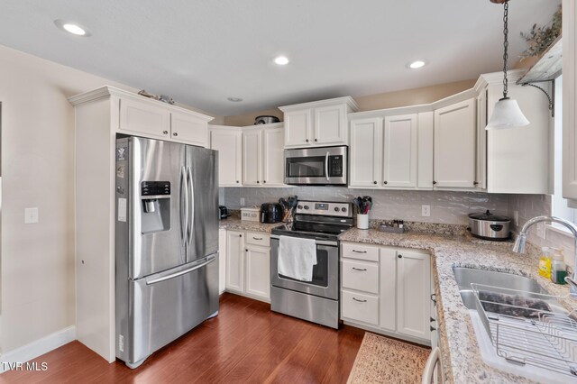 105 Dewey Ct, Bristol, VA 24201 - kitchen with dark wood-style flooring, stainless steel appliances, and white cabinetry
