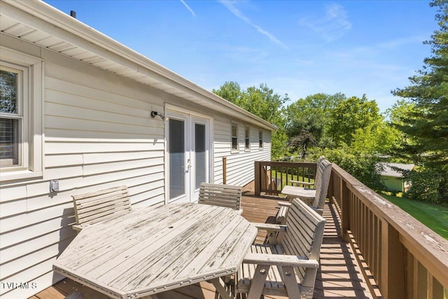deck featuring french doors and outdoor dining area